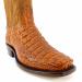 Close-up of genuine cognac caiman leather on custom square toe Western boots